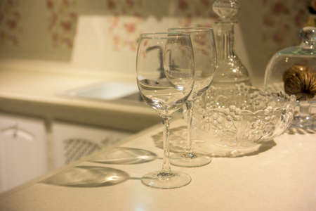 Simple home table setting, glasses in the kitchen interior.の写真素材