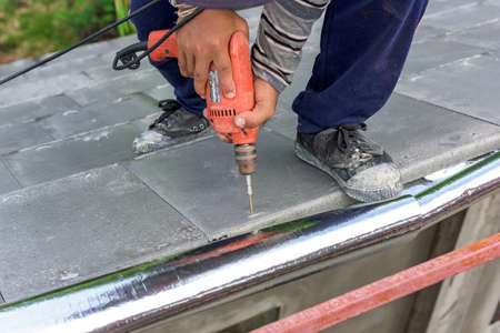 labor working in construction site for roofの写真素材