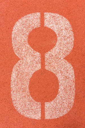 Number eight on the start of a running track - check my portfolio for other numbersの写真素材