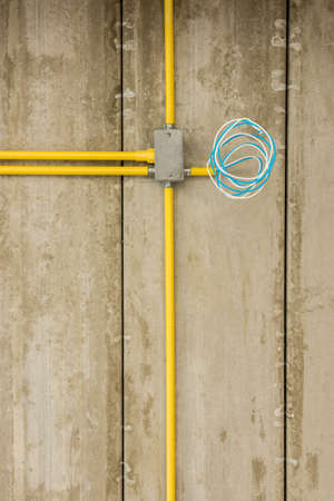 Electric wires installation and pipes of electricity in new house construction site.の写真素材