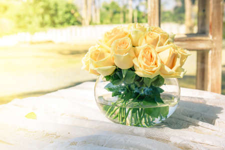 Wedding bouquet of yellow roses in glass jarの写真素材
