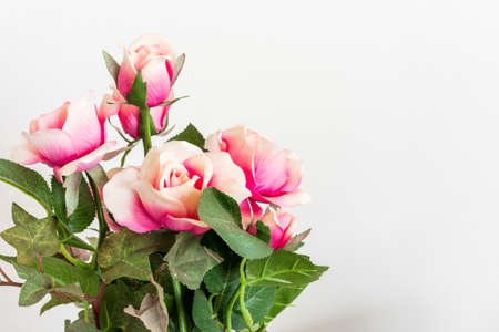 Artificial rose bouquet isolated on whiteの写真素材