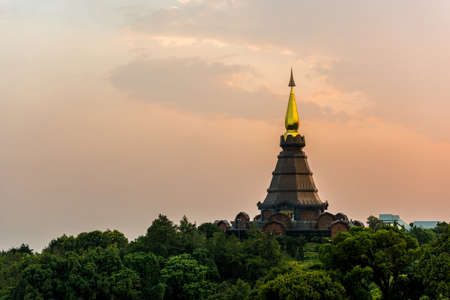 scene of a sunset at two pagoda on the top of Inthanon mountain, Chiang Mai, Thailand.の写真素材