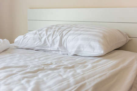 Messy bedding sheets and pillow