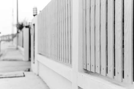 black and white of picket fence