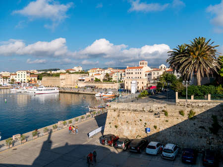 Alghero Marina and the ancient city with its walls in Sardinia, Italy.