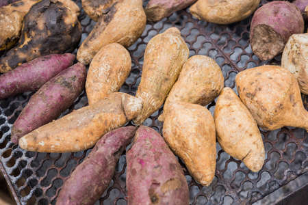 grilled sweet potato on charcoal grillの写真素材