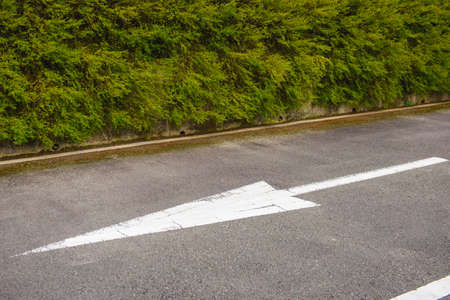 Asphalt road with arrowの写真素材