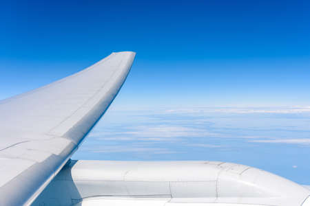 Wing aircraft in altitude during flightの写真素材