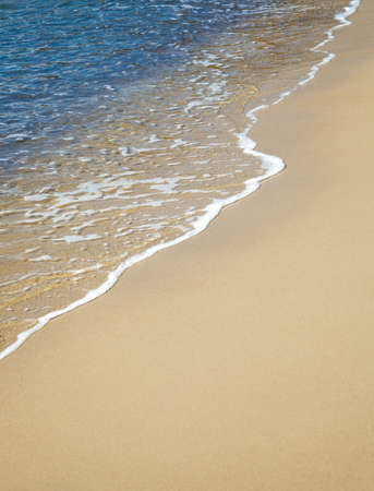 sand beach and calm waterの写真素材