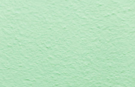 pastel green background with blurred texture