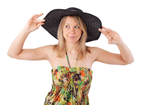 beautiful young woman in elegant hat and summer dressの写真素材