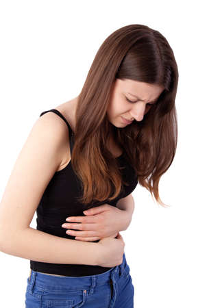 girl with stomach pain isolated on whiteの写真素材