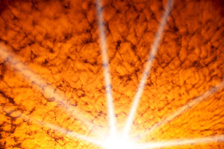 yellow sky with clouds at sunsetの写真素材