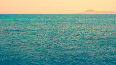 blue ocean water with coastline