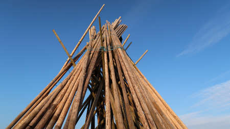 wooden poles against the sky