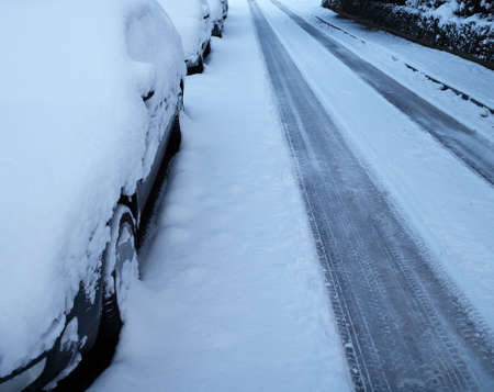 Parking cars covered with snowの写真素材