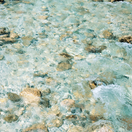 Clear water in the river with rocksの写真素材