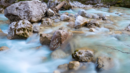 Clear water in the river with rocksの写真素材