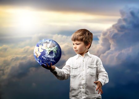 a child with a globeの写真素材