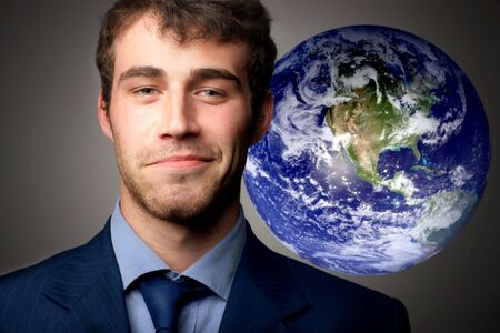 a portrait of a business man and a globeの写真素材