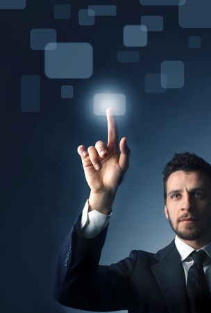 Businessman pressing  a button of a touchpad