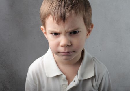 Child with angry expressionの写真素材