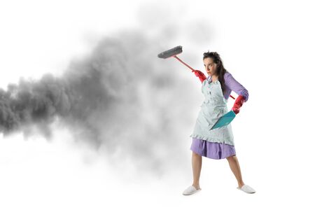 Housewife fighting against dustの写真素材
