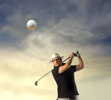 Man shooting a golf ballの写真素材