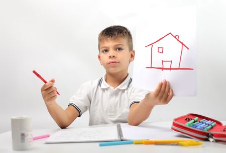 Child showing the drawing of a houseの写真素材