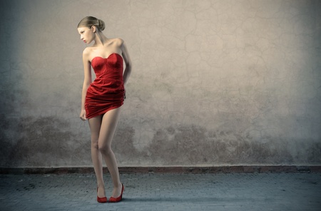 Beautiful woman with red dressの写真素材