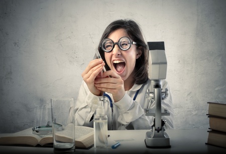 Crazy scientist holding a syringeの写真素材