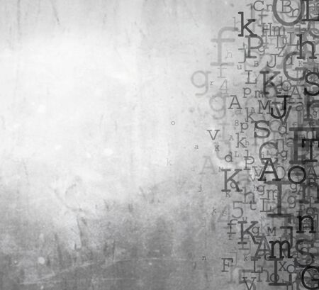 Alphabet letters and numbers on grey backgroundの写真素材