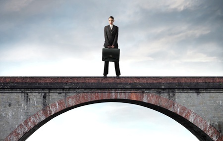 Businesswoman standing on a bridgeの写真素材