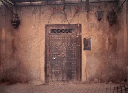 Old entrance door of a house in Marrakechの写真素材