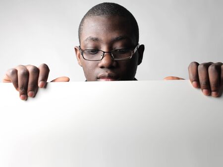 African businessman holding a billboardの写真素材