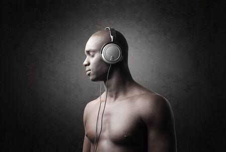 Handsome african man listening to musicの写真素材