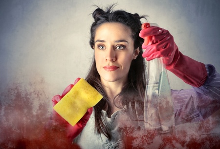 Housewife cleaning a glassの写真素材