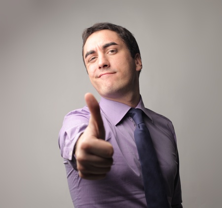 Businessman with thumbs upの写真素材