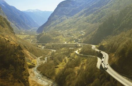 Panorama of a valley with highway running through itの写真素材