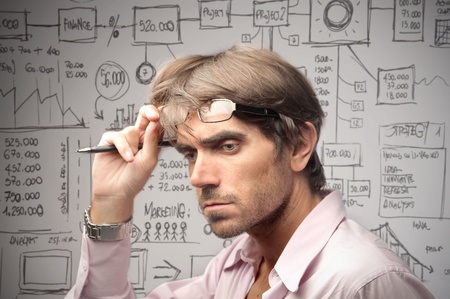 Young engineer with project in the backgroundの写真素材