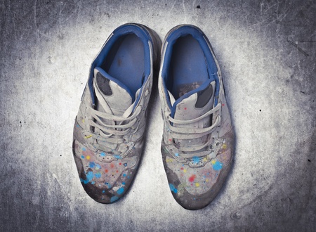 Old shoes full of color blotsの写真素材