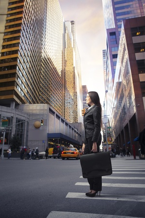 Beautiful businesswoman on a city streetの写真素材