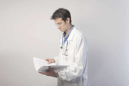Doctor reading some documentsの写真素材