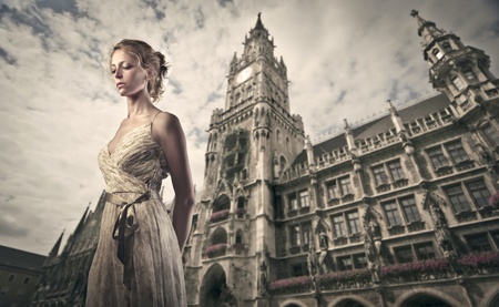 Beautiful woman with Rathaus of Munich in the backgroundの写真素材