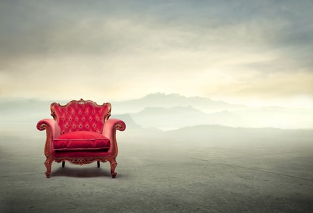 Old velvet armchair in a desertの写真素材