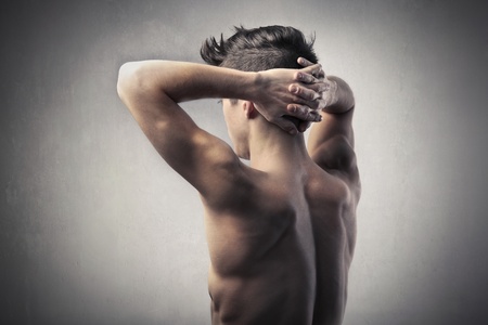 Rear view of a handsome bare-chested man