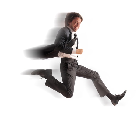 Smiling businessman running fastの写真素材