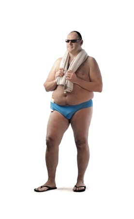 Fat man in swimsuit holding a bath towelの写真素材