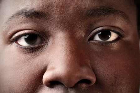 Closeup of an african woman's eyesの写真素材